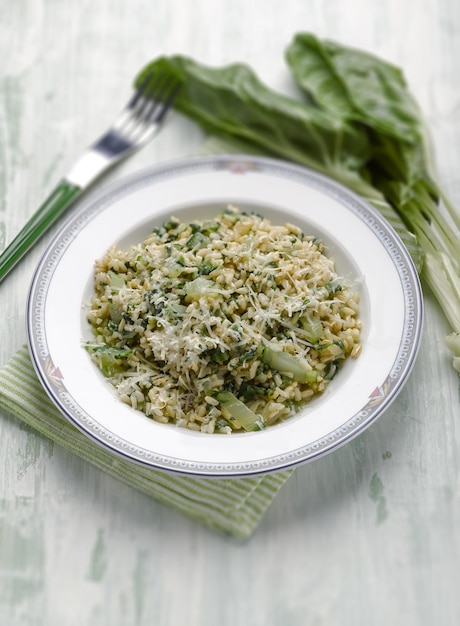 Risotto con bietole e parmigiano a fuoco selettivo