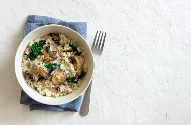 Risotto con funghi e spinaci