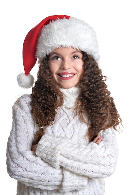 Ritratto di bambina sorridente con cappello di Natale su