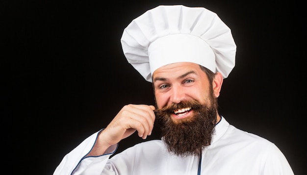 Ritratto di uno chef felice con cappello da cuoco