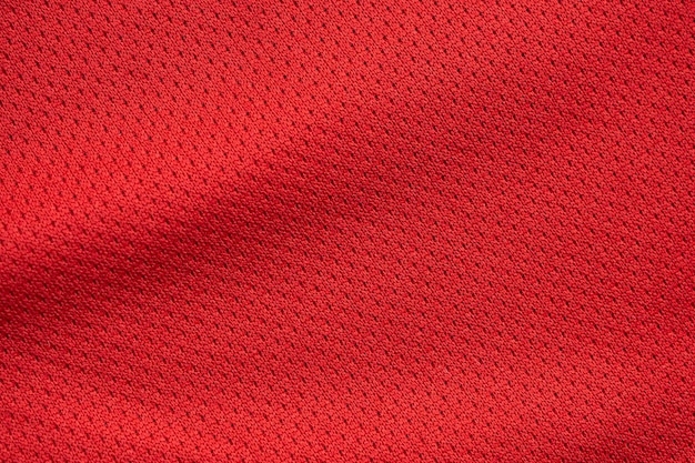 Rosso abbigliamento sportivo tessuto maglia da calcio texture da vicino