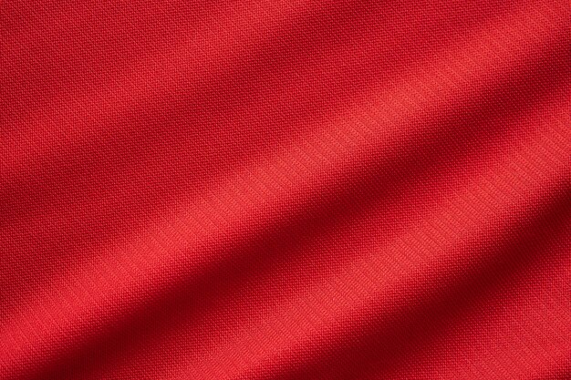 Rosso abbigliamento sportivo tessuto maglia da calcio texture da vicino
