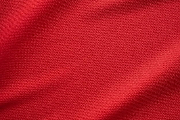 Rosso abbigliamento sportivo tessuto maglia da calcio texture da vicino