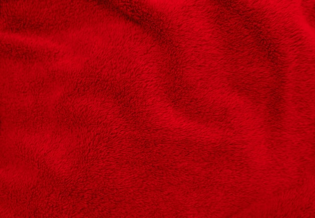 Rosso lana pulita texture sfondo luce naturale lana di pecora rosso senza cuciture in cotone struttura di soffice pelliccia per designer closeup frammento tappeto di lana rossa