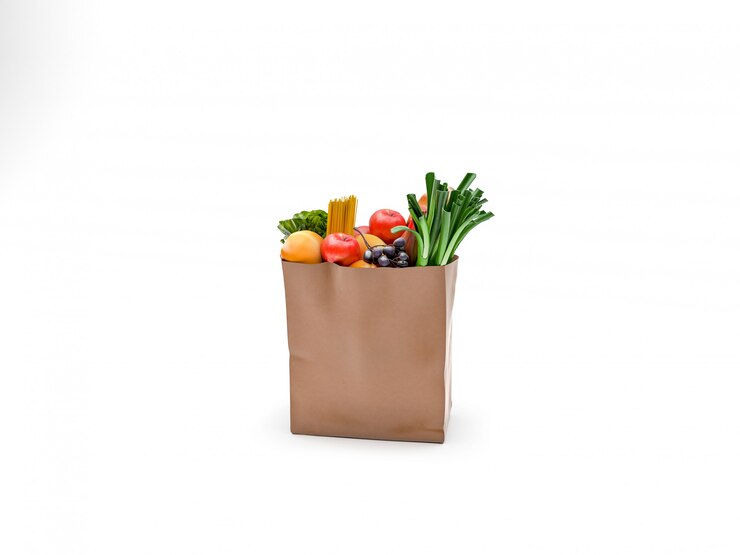 Sacco di carta con frutta e verdura verde