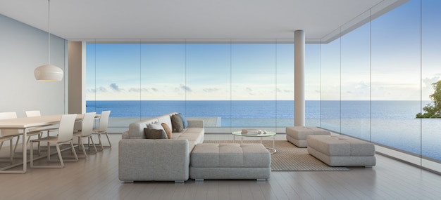 Sala da pranzo e soggiorno di casa sulla spiaggia di lusso con piscina vista mare in design moderno.