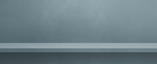 Scaffale vuoto su un muro grigio colorato. Scena del modello di sfondo. Banner orizzontale