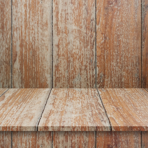 Scaffali o tavola di legno vuoti superiori sul fondo della parete.