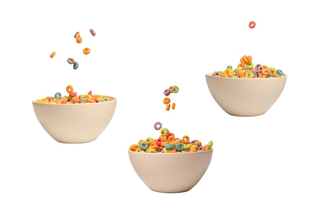 Scatola di cereali colorata per la colazione del mattino Fiocchi di mais che cadono nella ciotola bianca Motion Copyspace