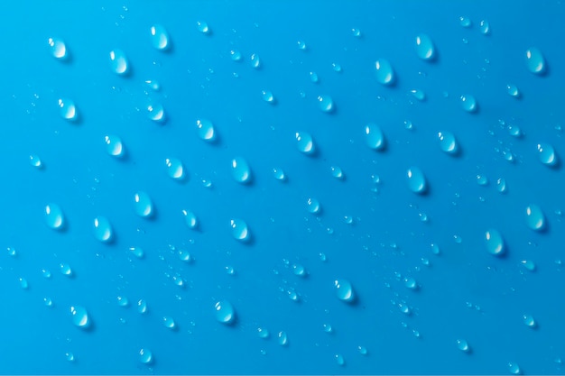 Scatto a fotogramma completo di gocce su sfondo blu