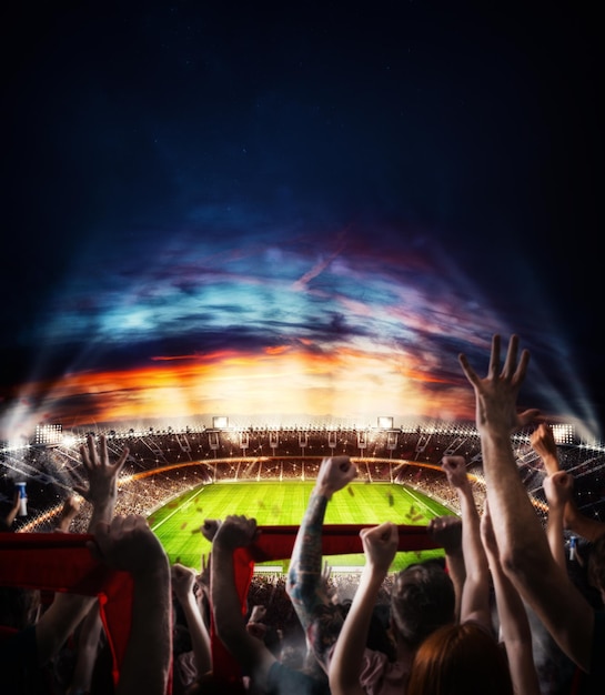 Scena di calcio durante la partita notturna con tifosi acclamati allo stadio