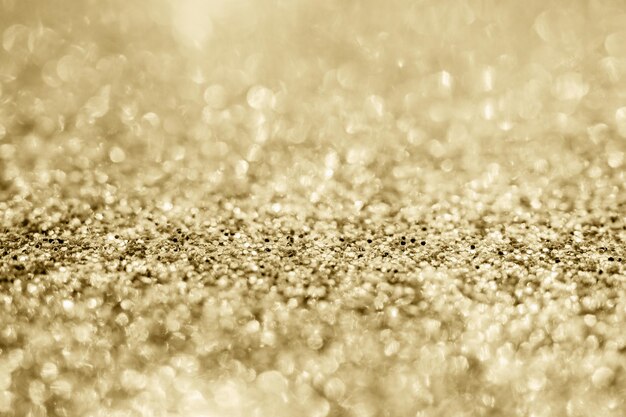 Scintilla d'oro astratta con sfondo bokeh