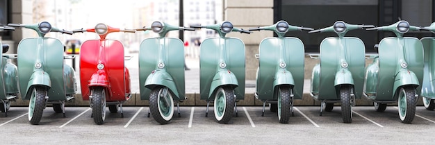 Scooter ciclomotore d'epoca in fila su un parcheggio della città