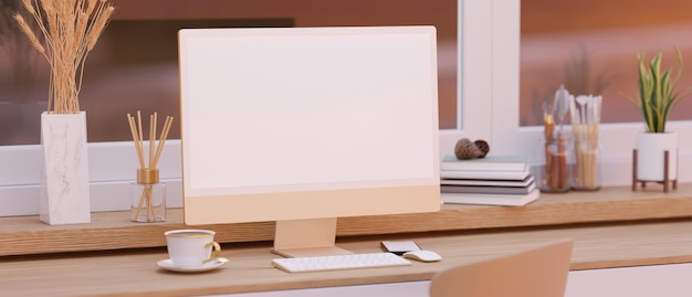 Scrivania da ufficio femminile moderna ed elegante con mockup e accessori per schermo bianco computer pc rosa pastello