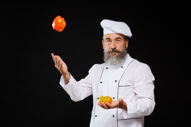 Senior Chef Juggling Vegetables