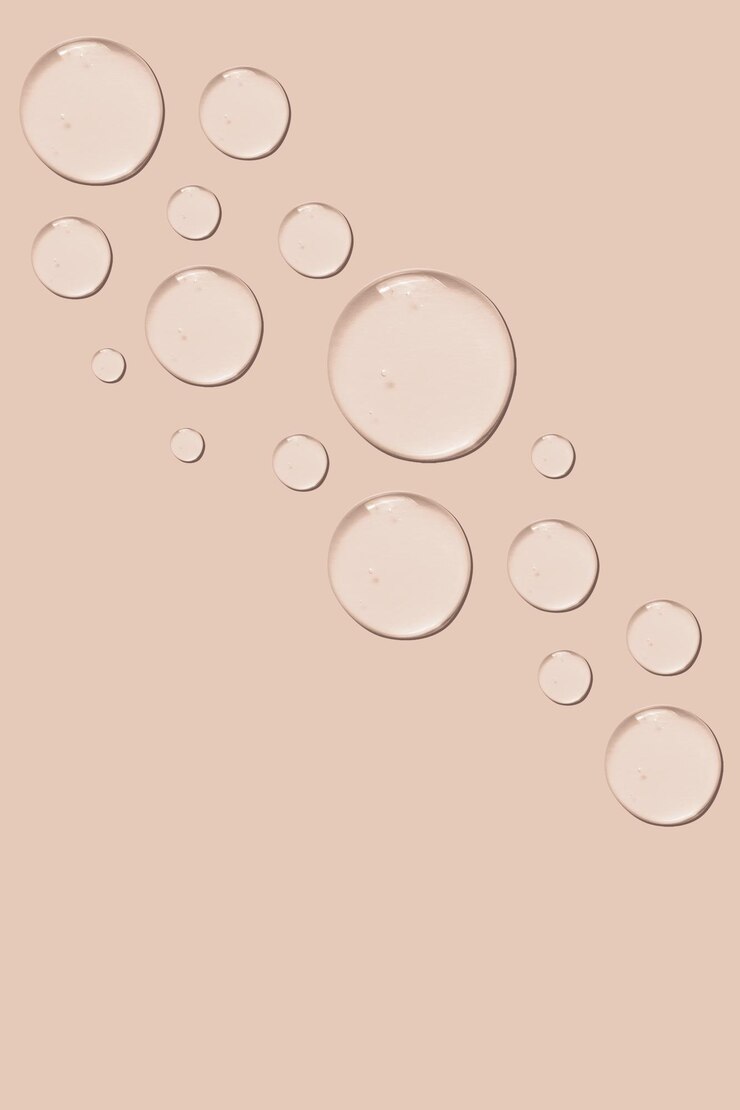 Set di gocce di consistenza gel su sfondo rosa
