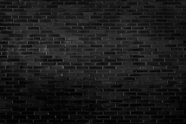 Sfondio astratto a parete di mattoni neri e sfondo nero Spazio bianco per la copia