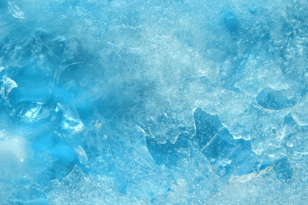 Sfondio di consistenza di crepe congelate sulla superficie di ghiaccio blu