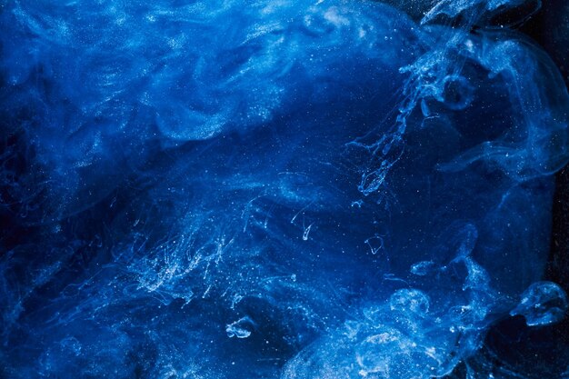 Sfondo astratto arte fluida liquida Vernice acrilica blu oceano di fumo galattico subacqueo