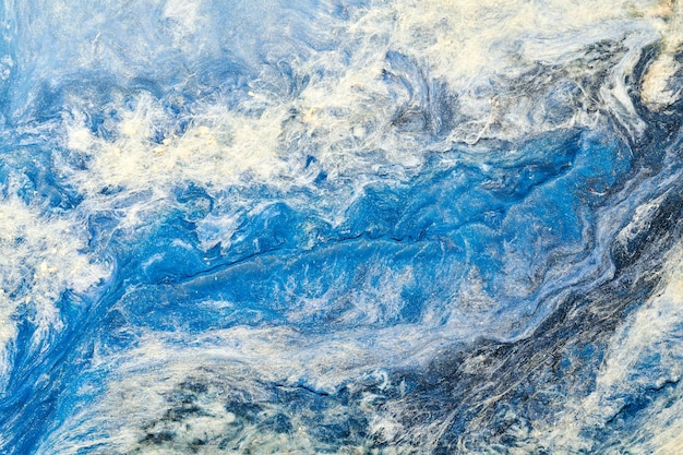 Sfondo astratto di colore blu Arte fluida multicolore Spruzzi e macchie di onde acriliche con inchiostro a base di alcol sotto l'acqua