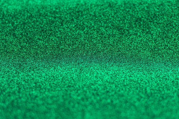 Sfondo astratto glitter verde con sfocatura