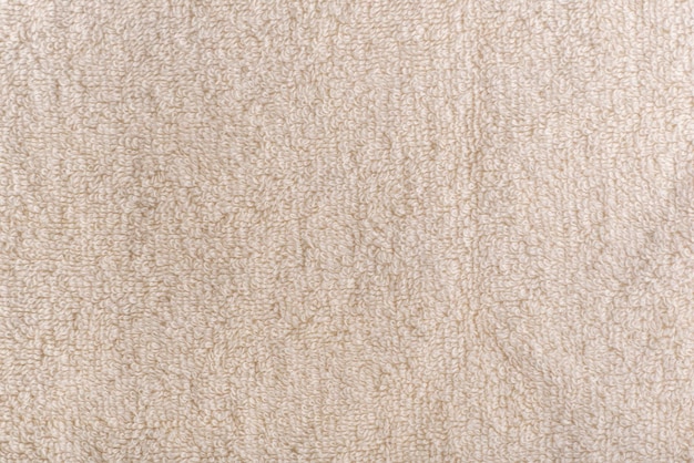 Sfondo beige omogeneo Tessuto lattiginoso Superficie tessile Asciugamano in spugna