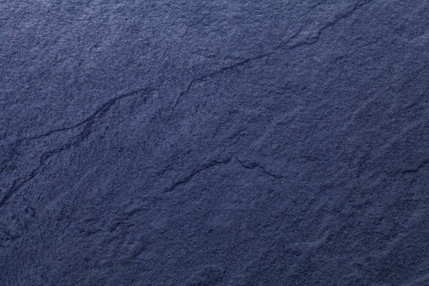 Sfondo blu navy di ardesia naturale. Struttura del primo piano di pietra.