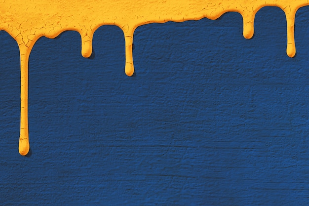 Sfondo con trama del muro di cemento dello stucco in blu su cui scende la vernice gialla scorre verso il basso.
