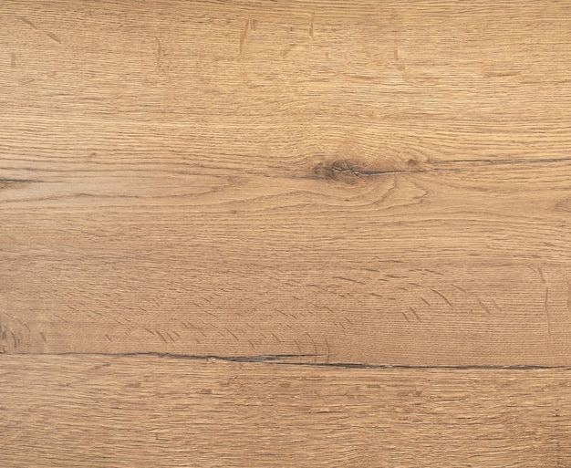 Sfondo da un pannello laminato imitazione di legno di quercia vecchio con nodi e crepe