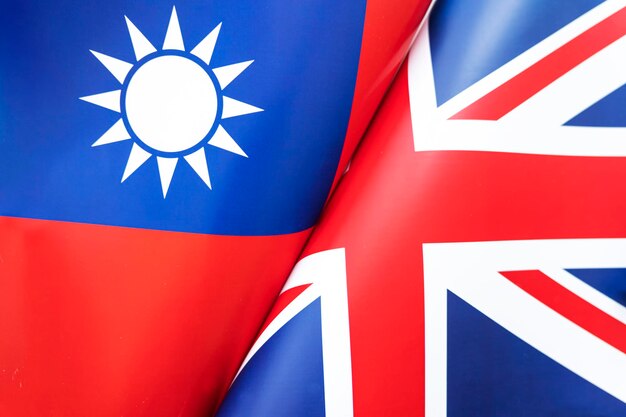 Sfondo delle bandiere di Taiwan e Gran Bretagna Il concetto di interazione o contrasto tra due paesi Relazioni internazionali Negoziati politici Competizione sportiva