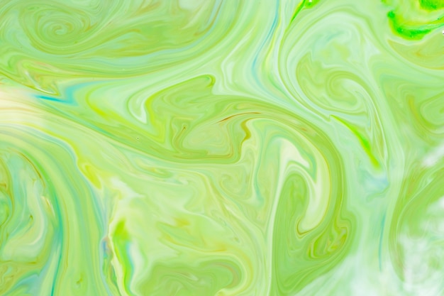 Sfondo di arte fluida verde. Reticolo astratto liquido con UFO verde. Struttura in marmo della superficie liquida. Arte fluida