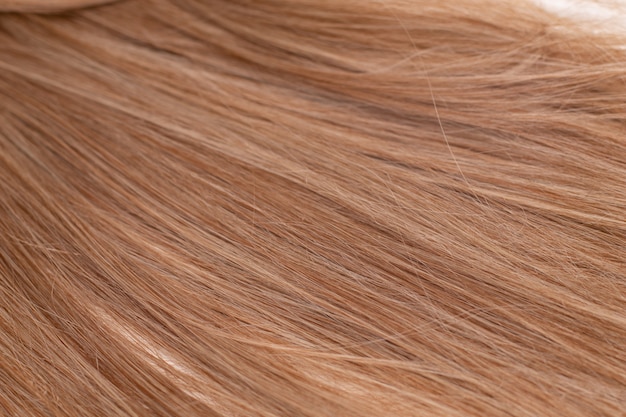 Sfondo di capelli biondi. Texture capelli biondi femminili