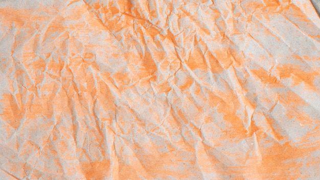 Sfondo di carta arancione stropicciata con texture Sfondo di carta stropicciata con texture e tratti