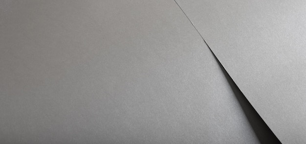 sfondo di carta di colore grigio lucido liscio luminoso lucente argento consistenza di alluminio striscia orizzontale
