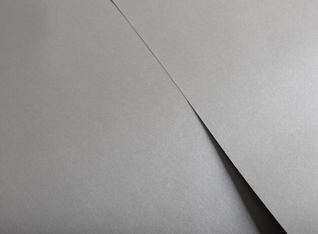 sfondo di carta di colore grigio lucido liscio luminoso lucido argento consistenza di alluminio fogli piegati
