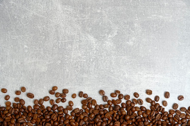 Sfondo di chicchi di caffè arrostiti struttura leggera in cemento