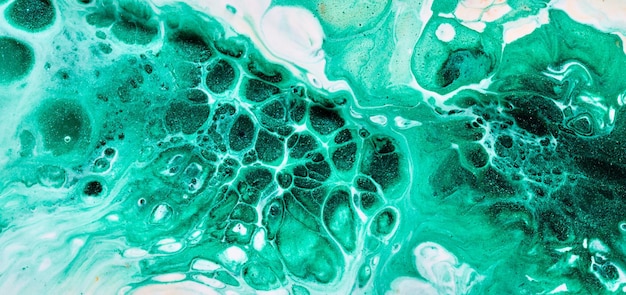 Sfondo di colore verde astratto Arte fluida multicolore Spruzzi e macchie di onde acriliche con inchiostro a base di alcol sotto l'acqua