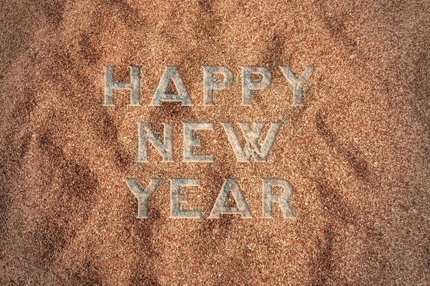 Sfondo di felice anno nuovo 2017 sulla sabbia