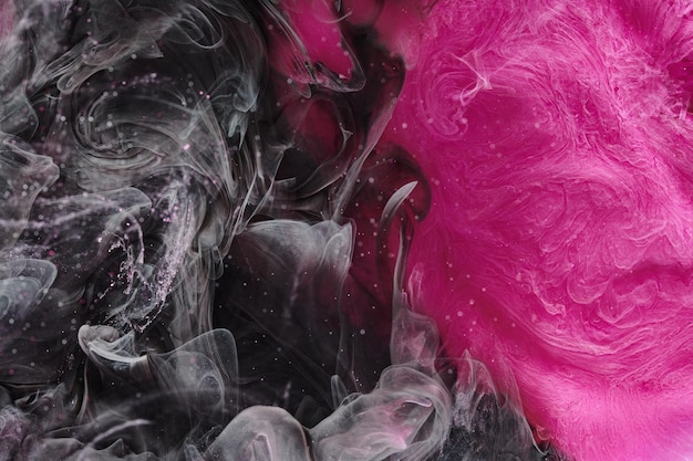 Sfondo di fumo astratto di colore rosa nero Mescolare l'inchiostro di alcool creativo mockup di arte liquida con spazio di copia La vernice acrilica ondeggia sott'acqua