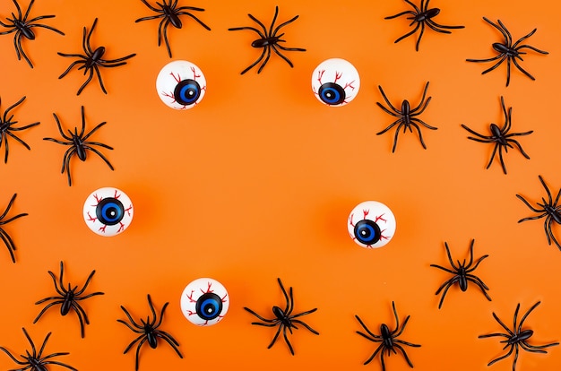 Sfondo di Halloween con occhi e ragni