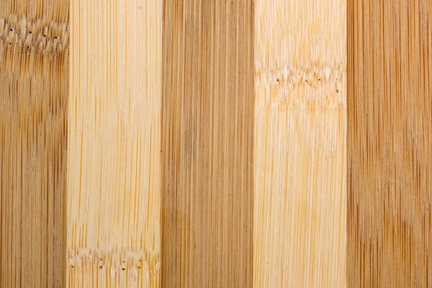 Sfondo di legno dalla superficie della plancia di macrofotografia ravvicinata in legno trattato con luce