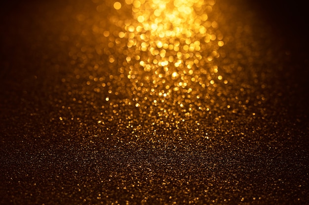 Sfondo di luci glitter oro e nero Sfondo astratto sfocato