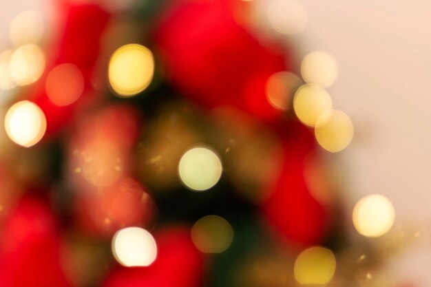 Sfondo di Natale. Effetto bokeh, sfumature di rosso e oro.