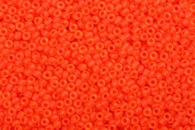 Sfondo di perline di semi arancioni rossi Foto ad alta risoluzione