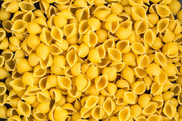 Sfondo di Un mucchio di gusci di pasta di conchiglie