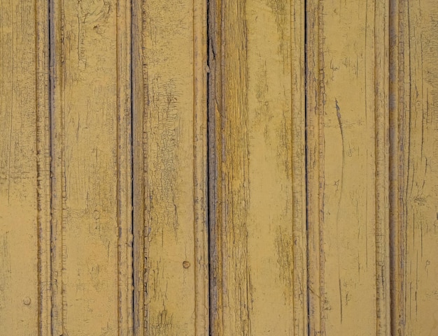 Sfondo in legno antico colore giallo Sfondo texture in legno Facciata di una casa in legno
