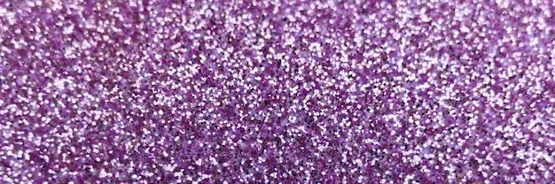 Sfondo sfocato viola glitter da vicino