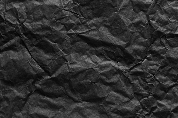 Sfondo texture carta nera stropicciata per il design nel tuo concetto di lavoro.