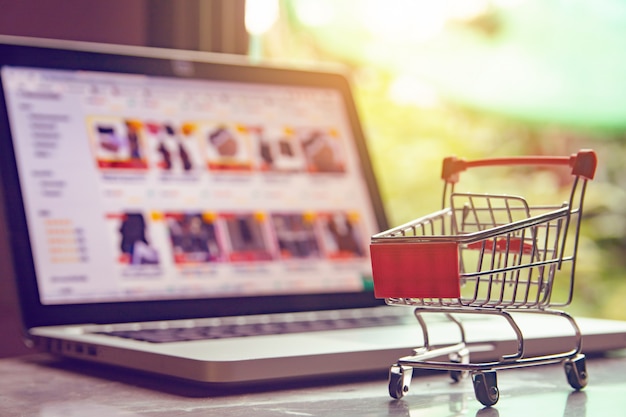 shopping cart or trolley on a laptop keyboard