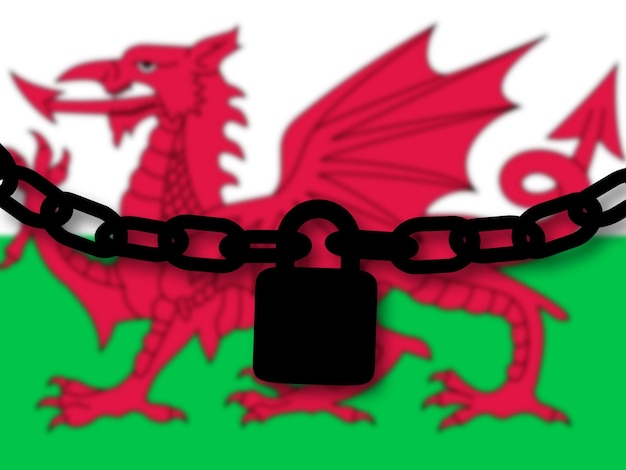 Sicurezza del Galles Silhouette di una catena e un lucchetto sopra la bandiera nazionale